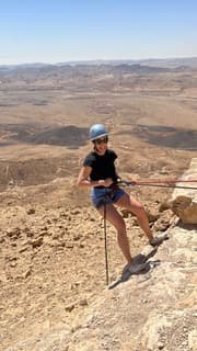 Sandra Hodes hiking through a desert landscape