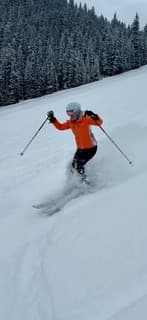 Sandra Hodes skiing through fresh snow